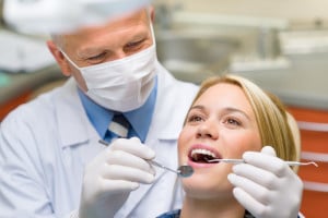 A woman receives a dental procedure