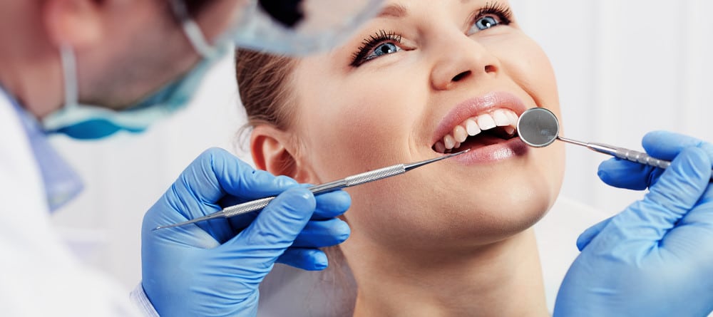 A woman receives a dental treatment