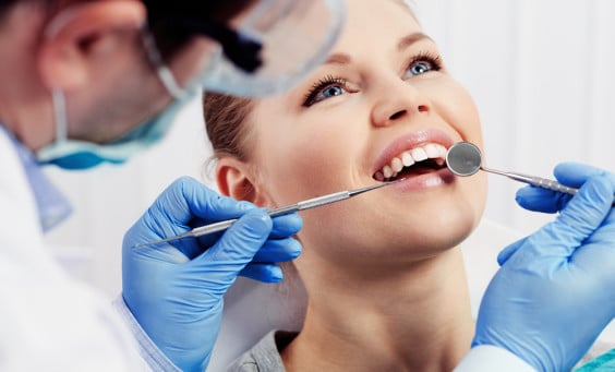 A woman receives a dental treatment